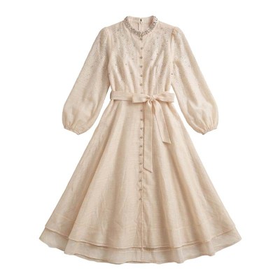 Robe Stella longue perlée à col brillant et coupe fluide