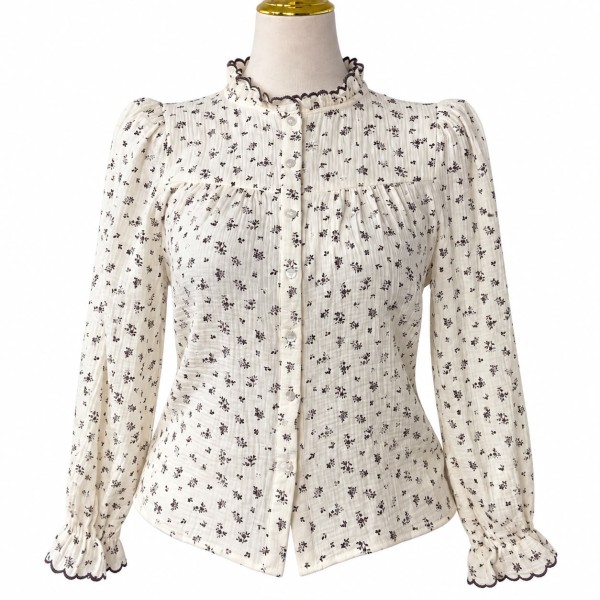 Chemise femme fleurie à manches longues et col volanté élégant