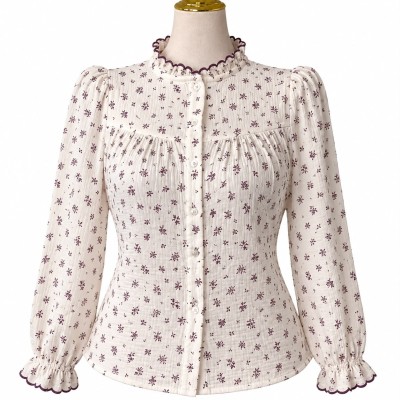 Chemise femme fleurie à manches longues et col volanté élégant